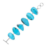 Sterling Silver bracelet with vibrant Turquoise Shell panels, handcrafted in Bali.